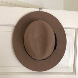 Tan hat with black bow